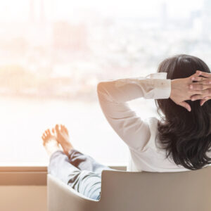 Woman looking out the window in an article on how to manage binge eating disorder from eating disorder recovery specialists.