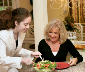 EDRS Counselor preparing food with a client